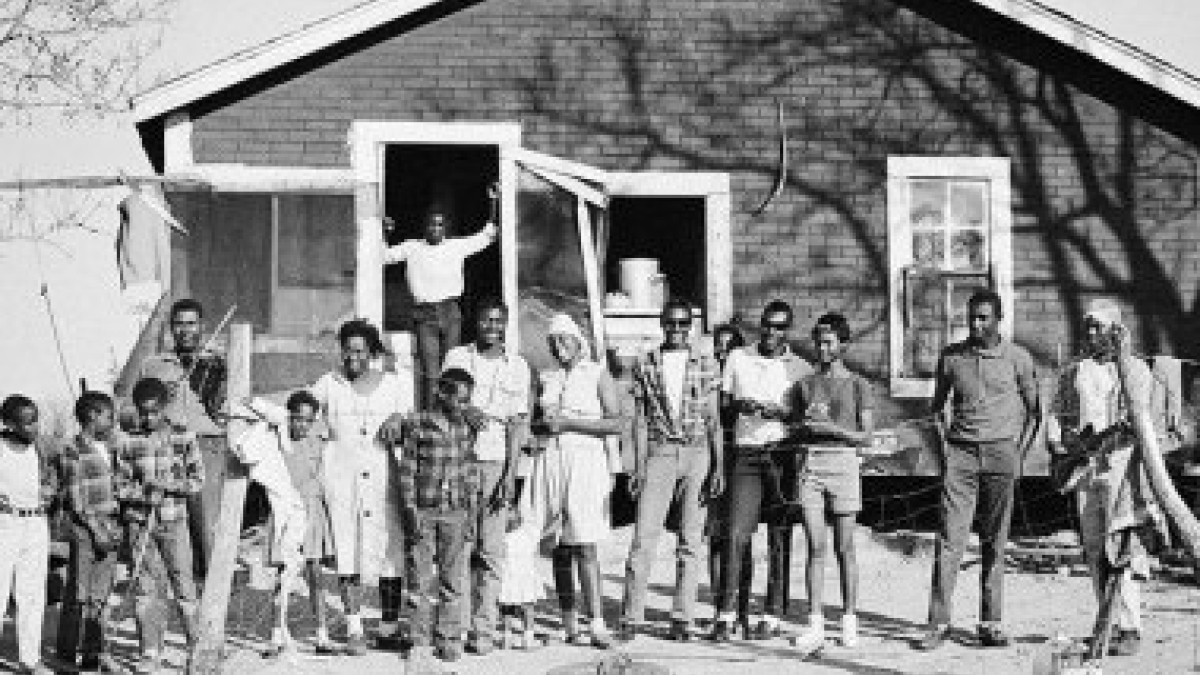 Country fiddler, wife, 14 children, and grandchildren © Julius Lester