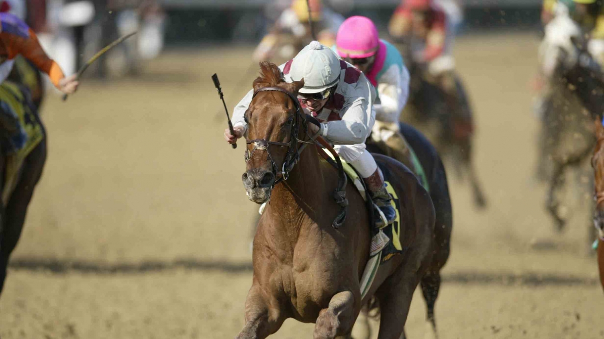 Funny Cide with Jose Santos up wins the 2003 Kentucky Derby at Churchill Downs by Vincent Dusovic