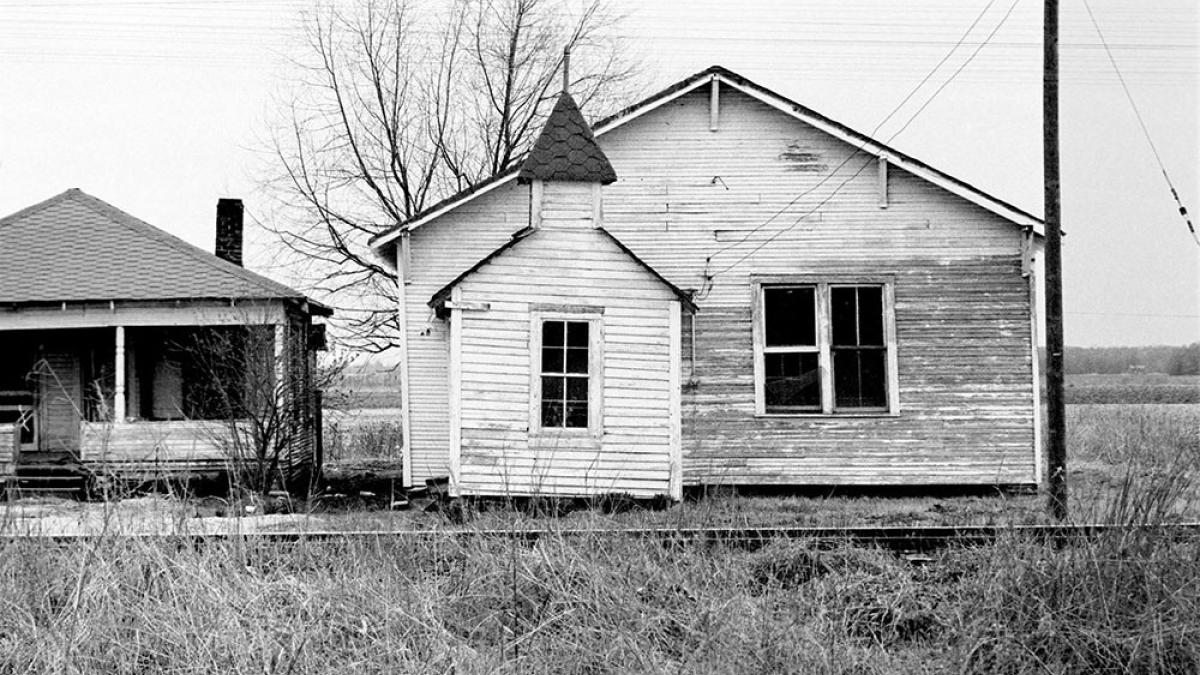 Black church and railroad tracks, Itta Bena, Miss © 1966 Julius Lester SOLD