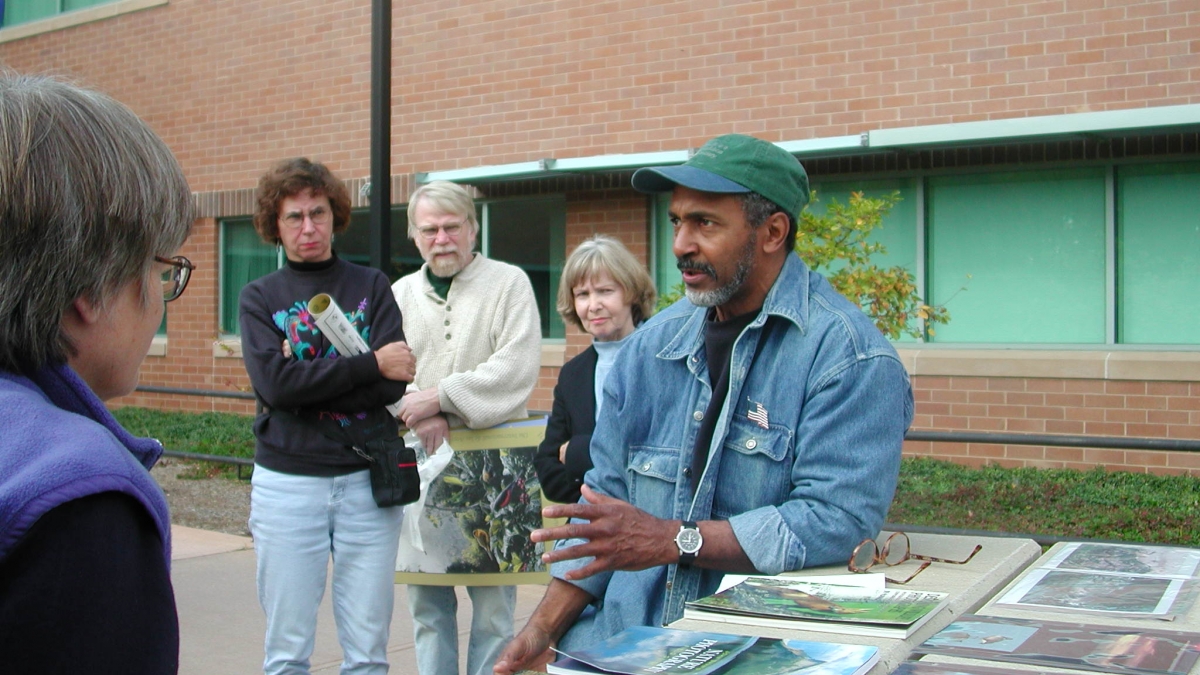John Green, Jr. gives an outdoor talk.